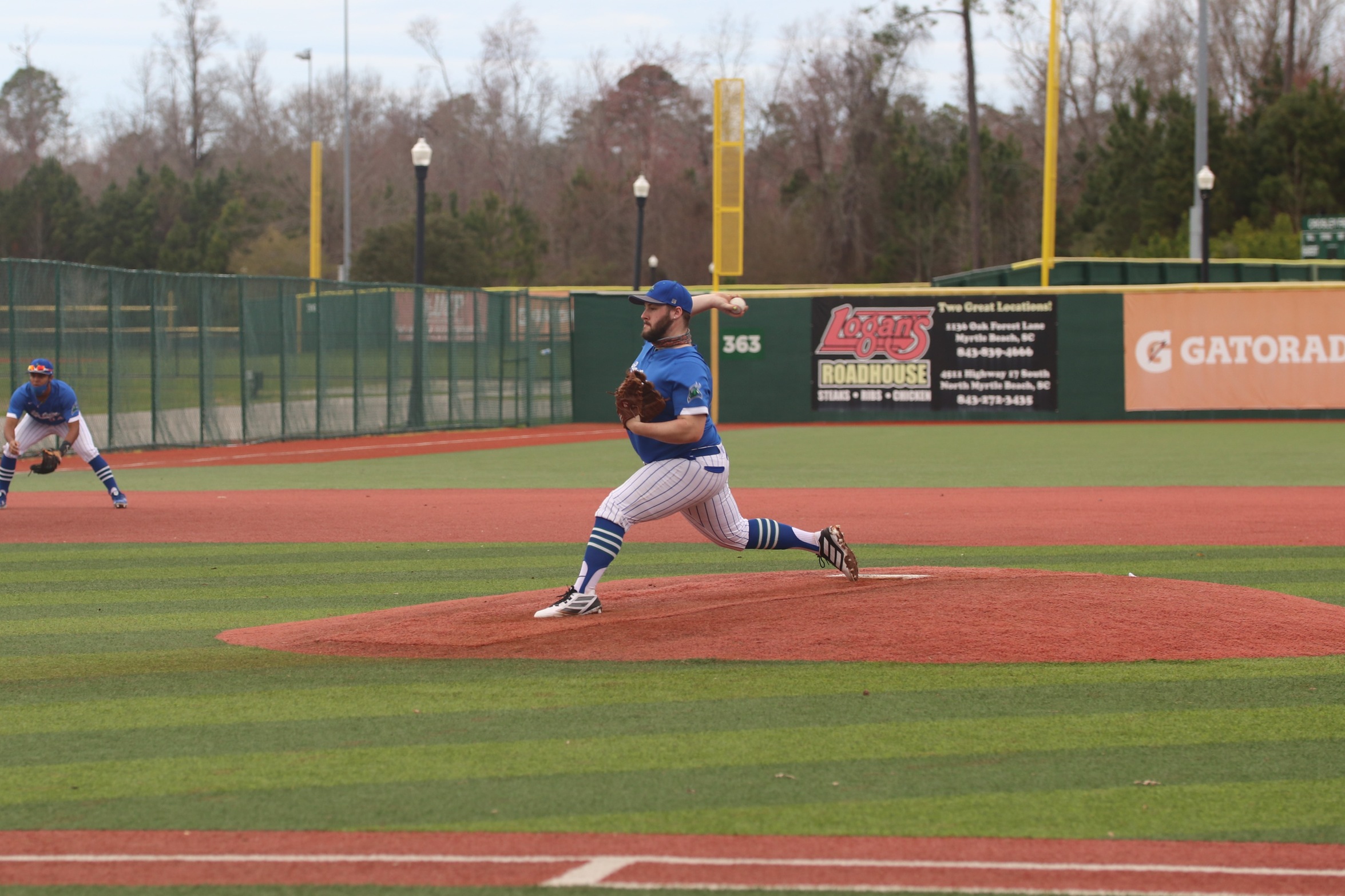Sam Schneider delivering a pitch