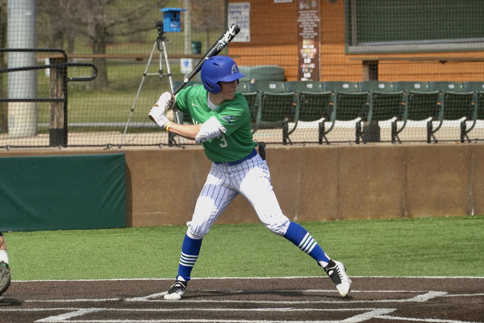 Tyler Darmogray in the batter's box, striding as a pitch approaches