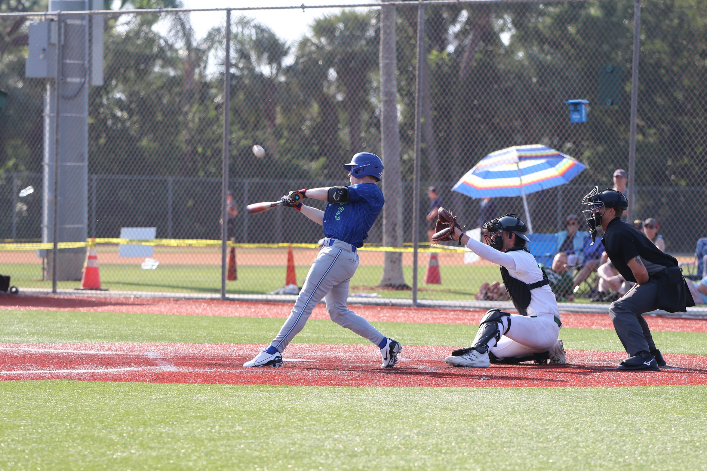 Logan Peterson just after contact with a ball that would land for an RBI single