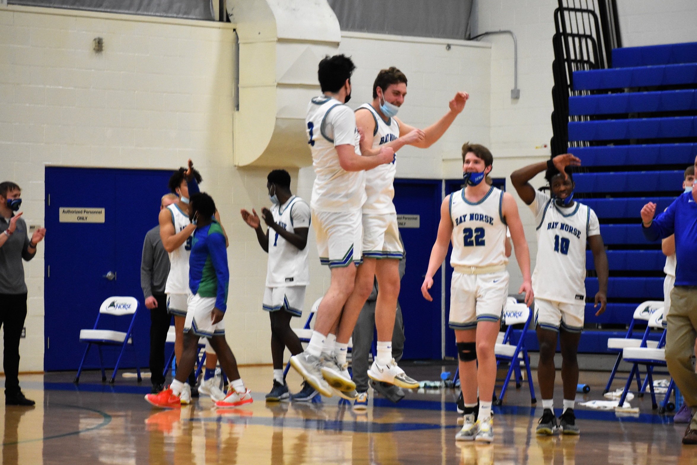 Norse Players celebrate near their bench