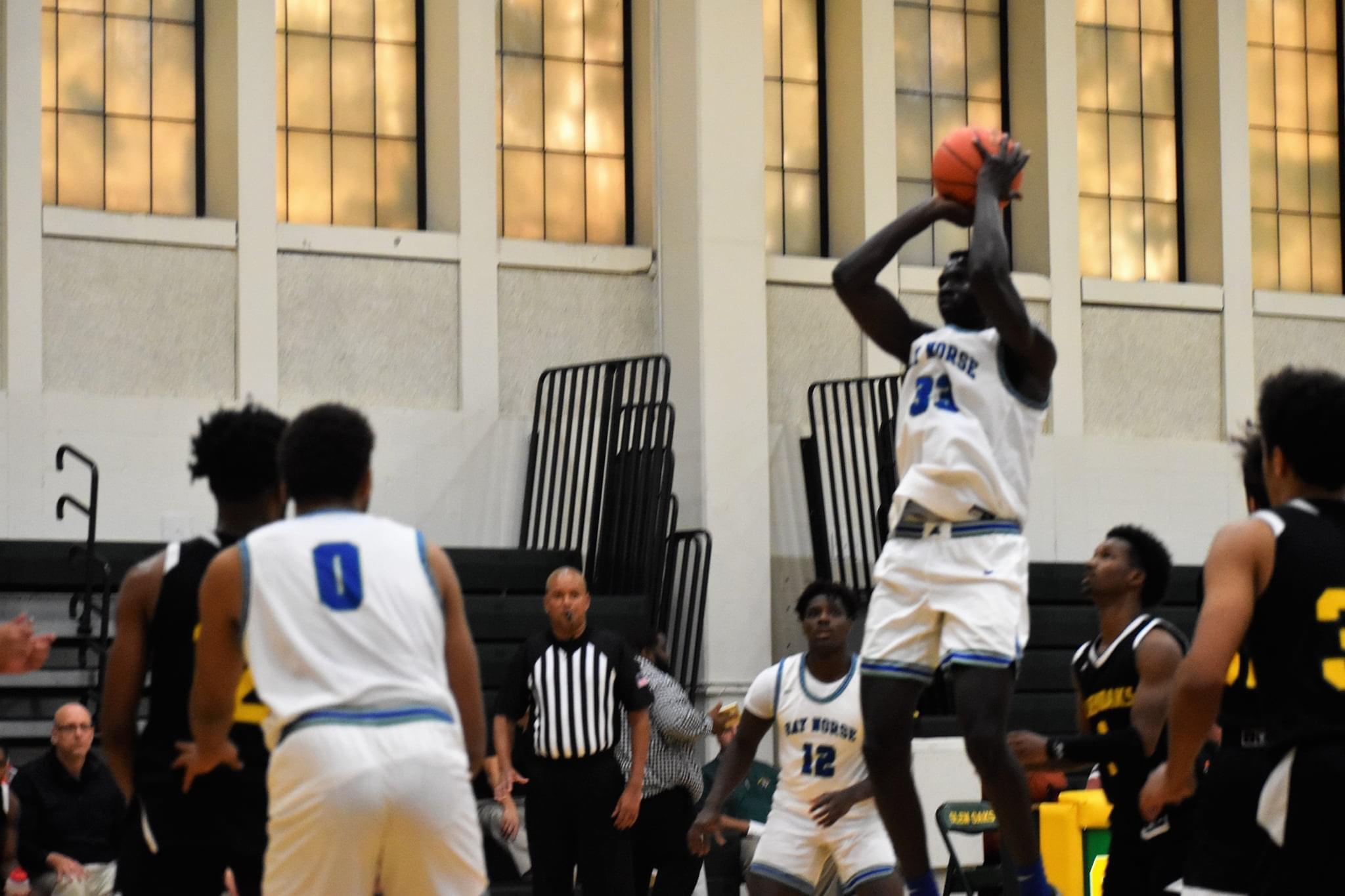 Diang Gatluak raising up to shoot a jumper