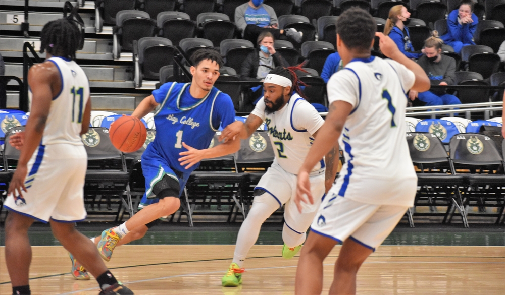 Jacquez Overstreet attacks from the wing with a defender close by