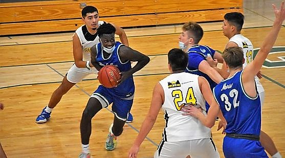 Jaylen Flaniken dribbles into the lane to take a shot
