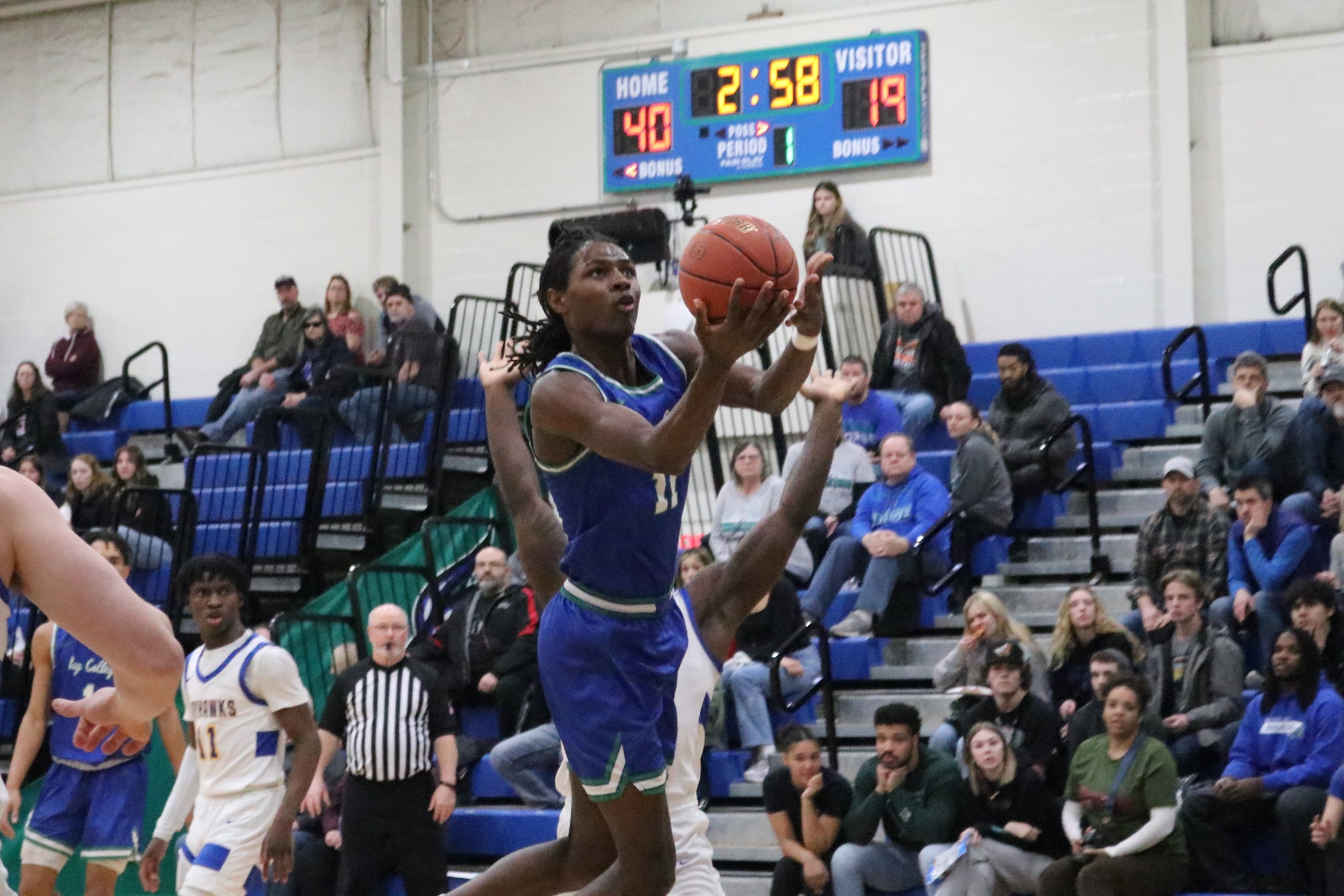 Genesis Kemp about to release a layup from the middle of the lane