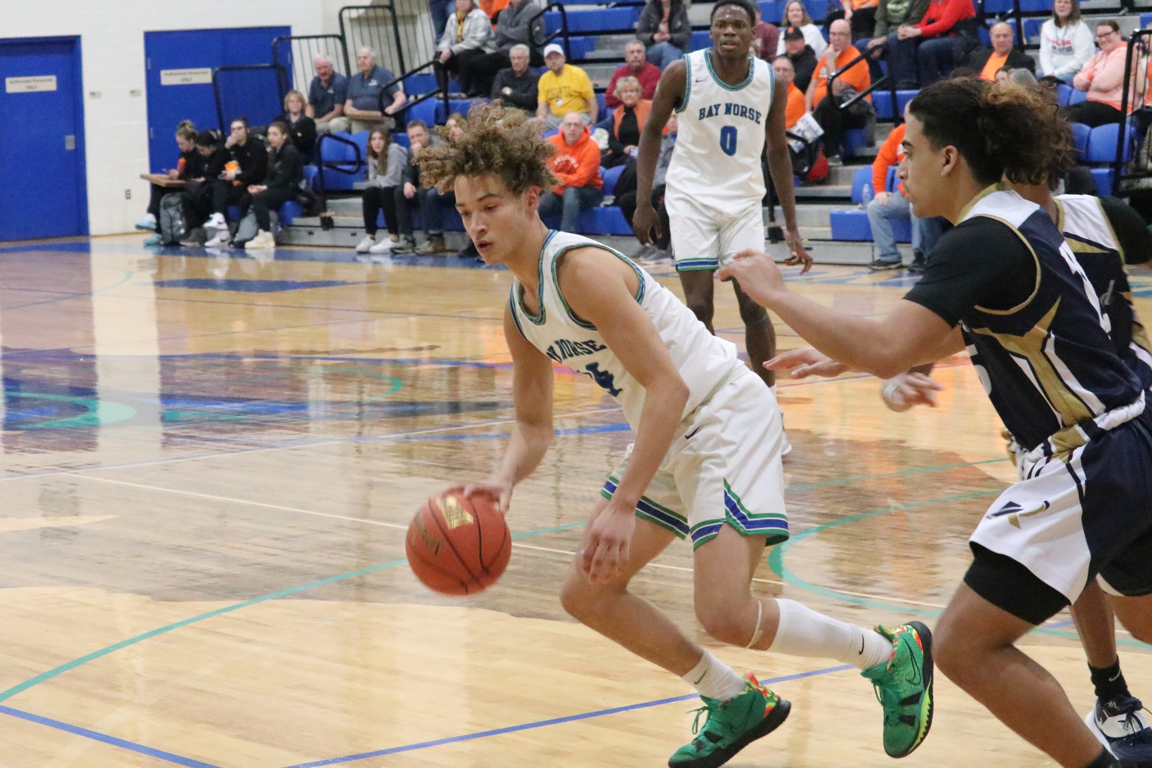 Tyrel Creger dribbles as a defender closes in