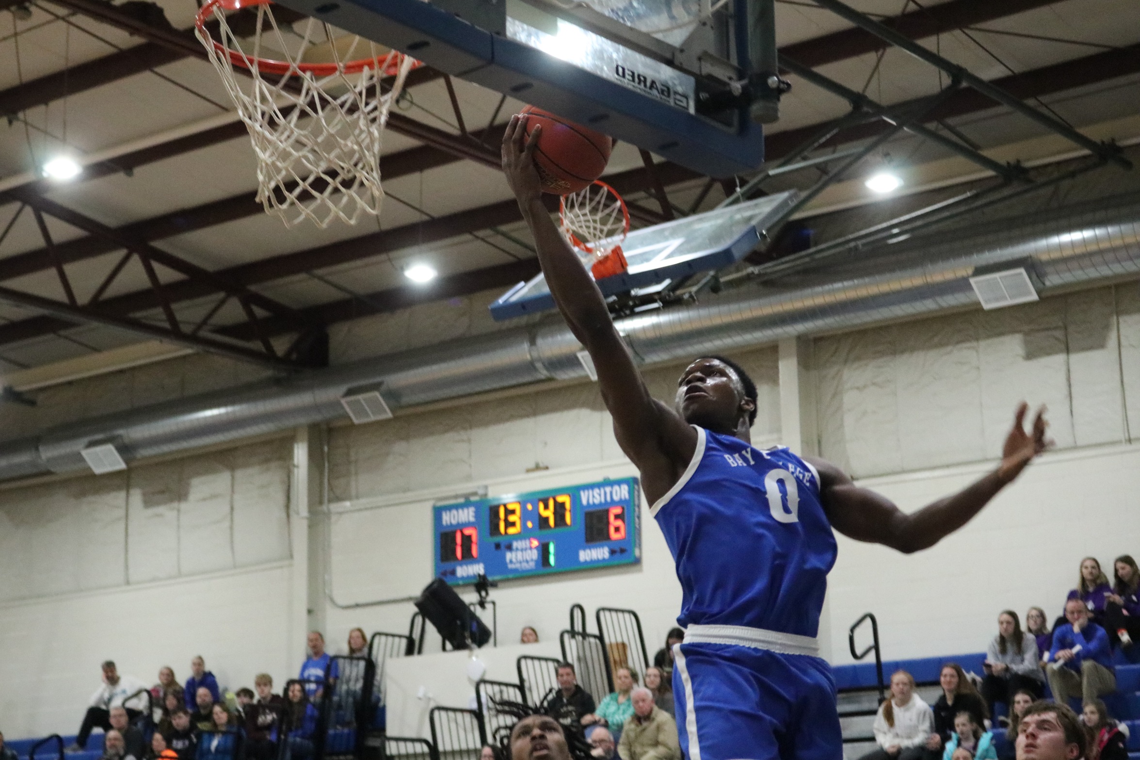Baril Mawo about to release a layup attempt right at the rim