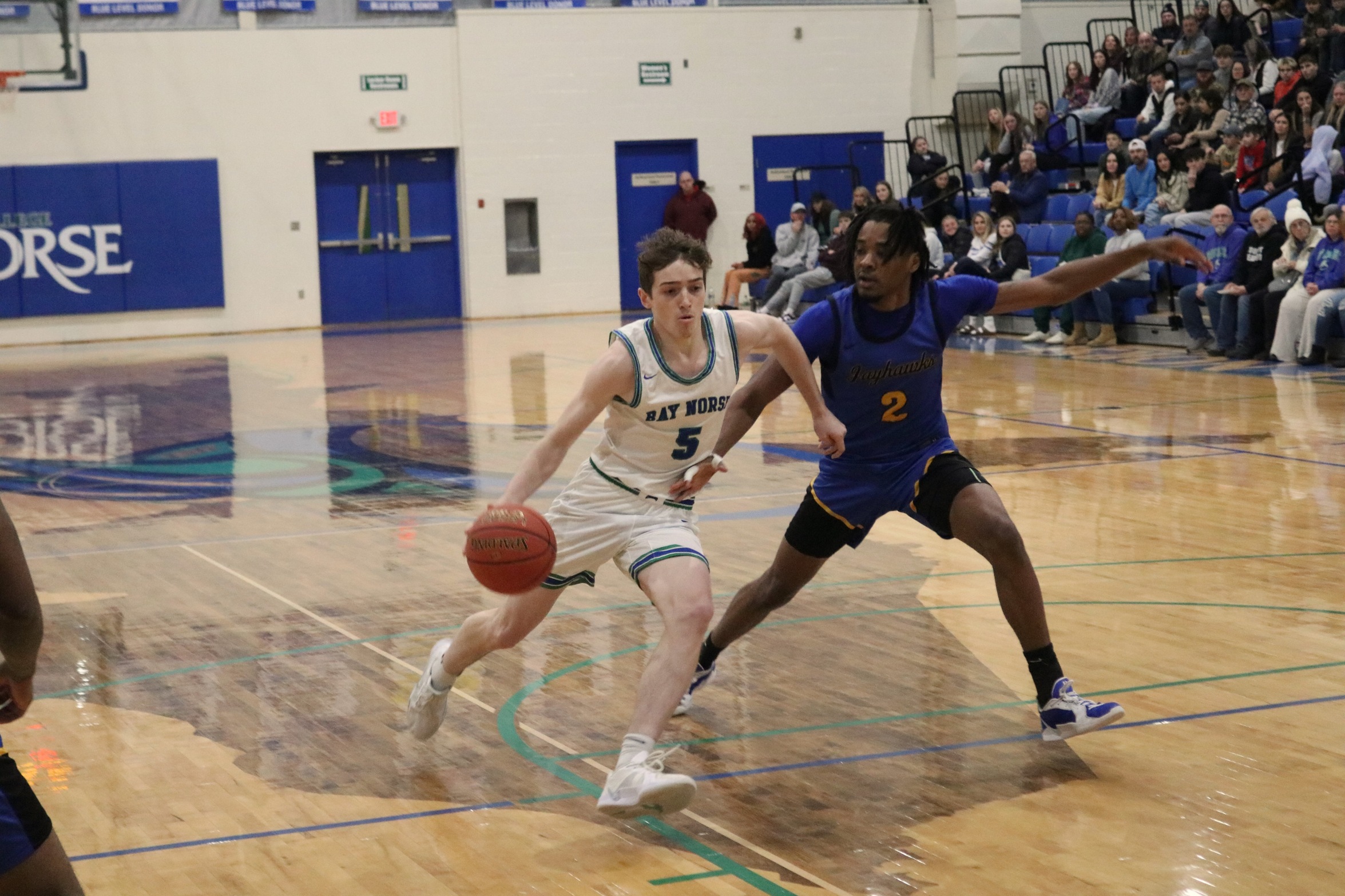 Ryan Sweeney dribbles down the lane line with a defender on his hip