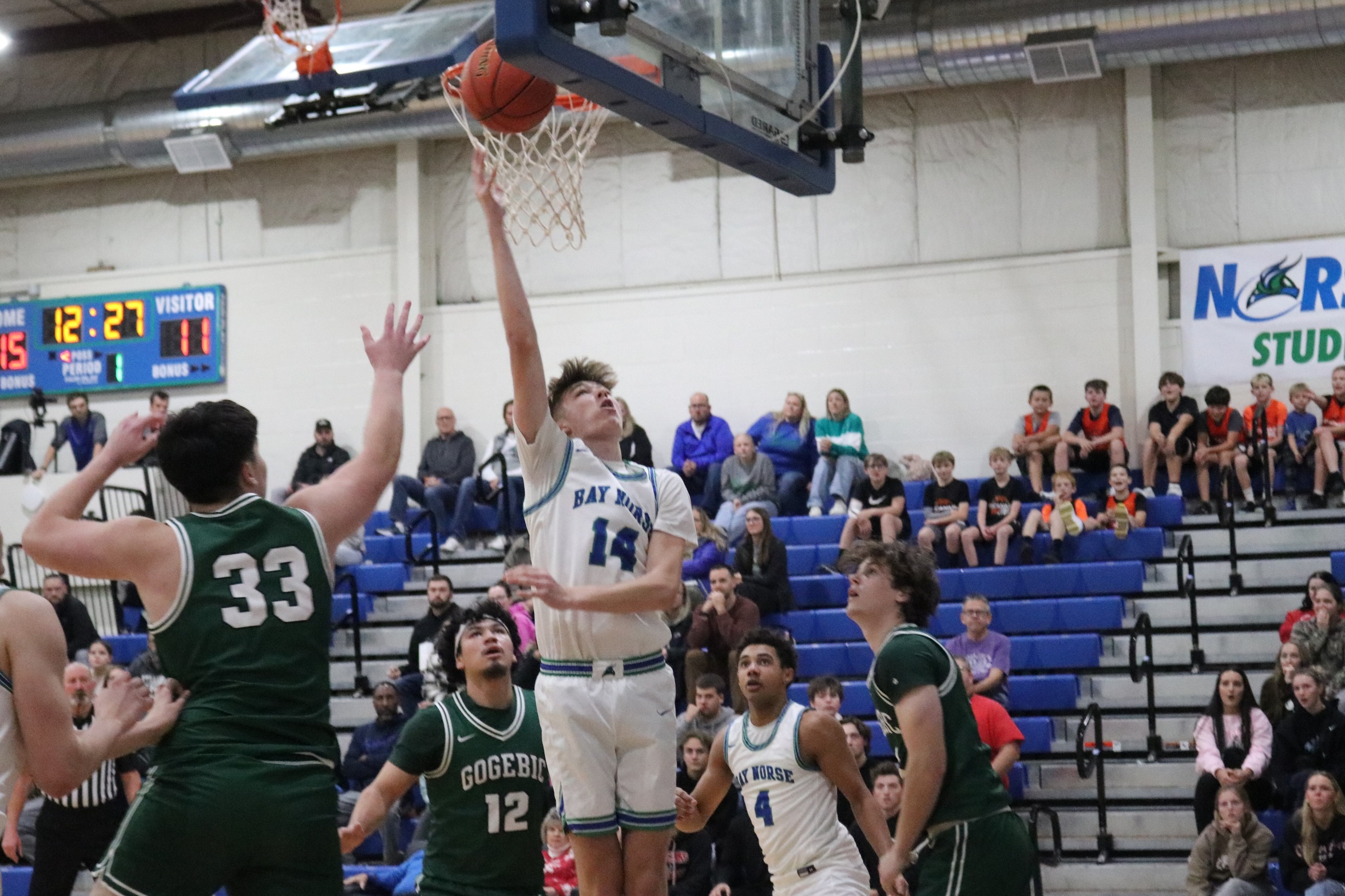 Connor Coduti laying the ball up near the rim