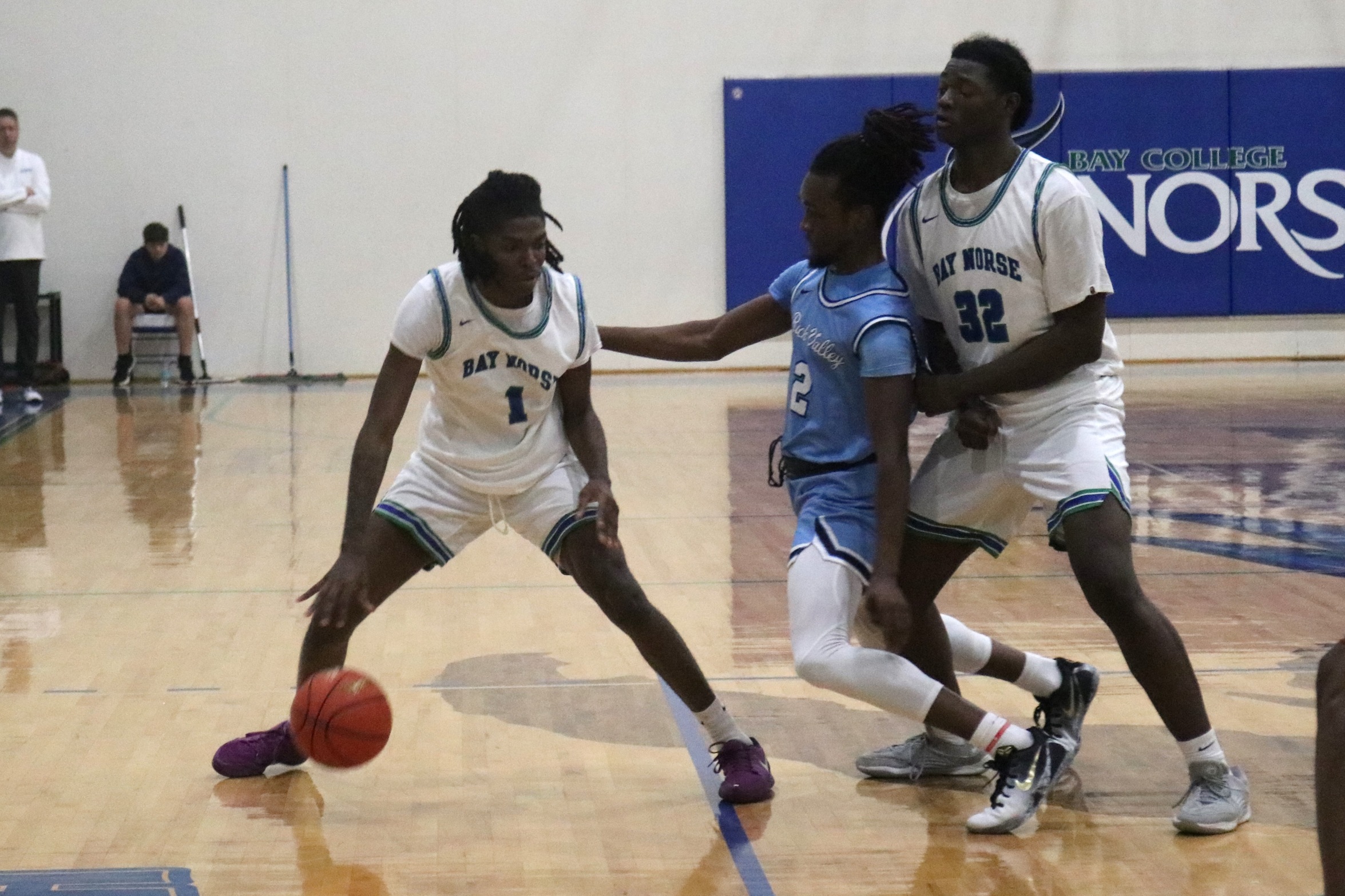 Adam Page dribbles as Savion Johnson sets a ball screen for him