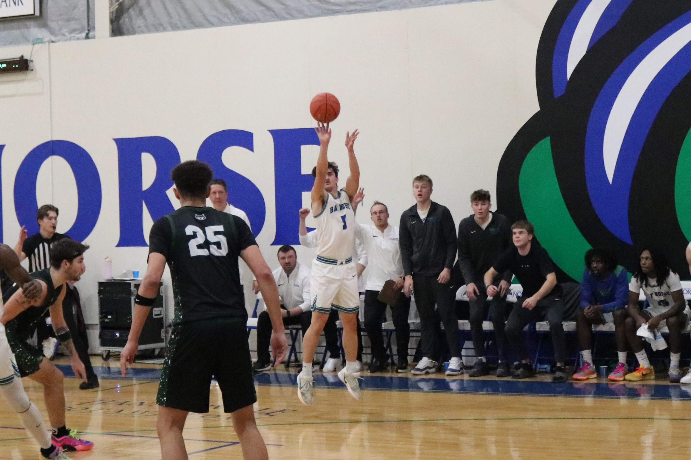 William Kelley fires up a three in front of the Bay bench