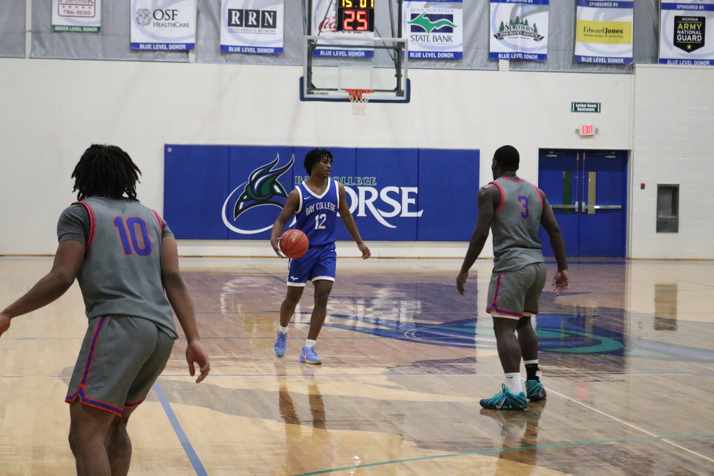 Trey Frye III dribbles up the court