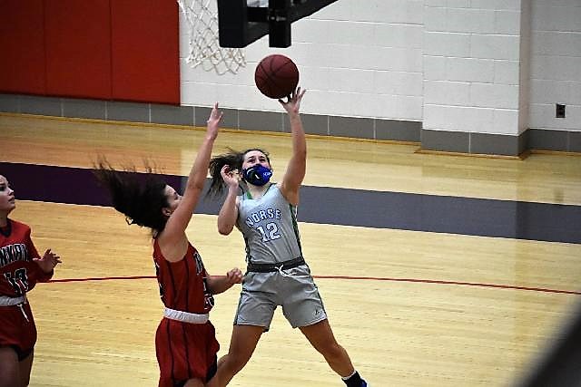 Cierra Molina shooting a left handed layup
