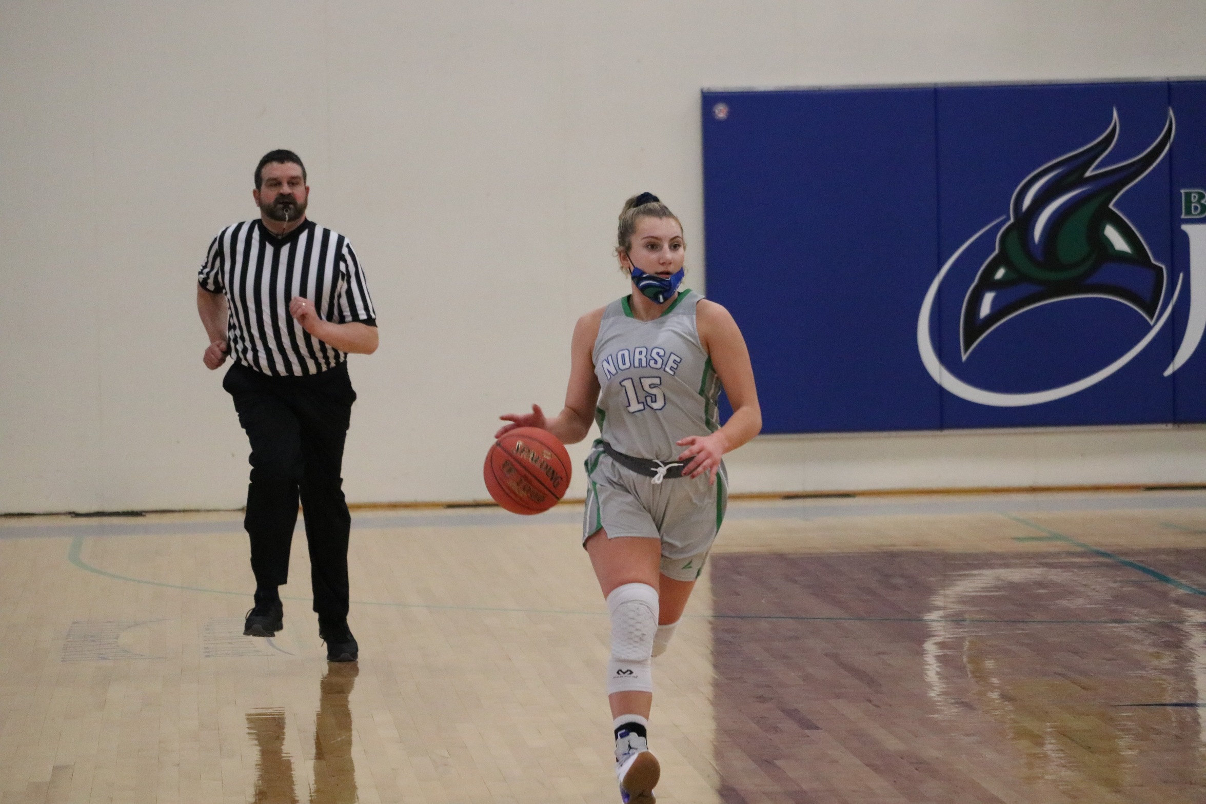 Holly Wardynski dribbling the ball up the court
