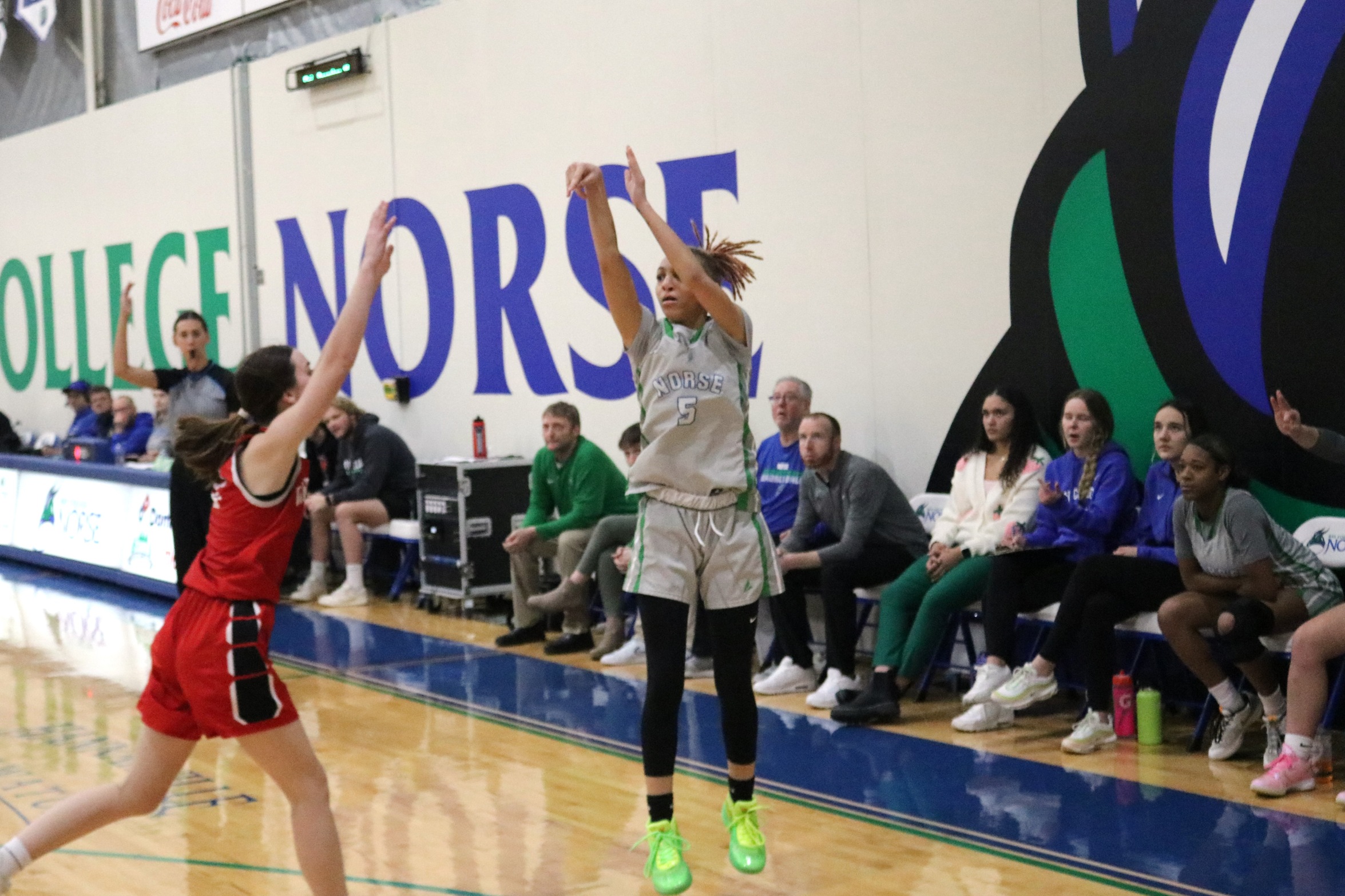 Ashlee Burchette just after releasing a three-point attempt, a defender is late closing out