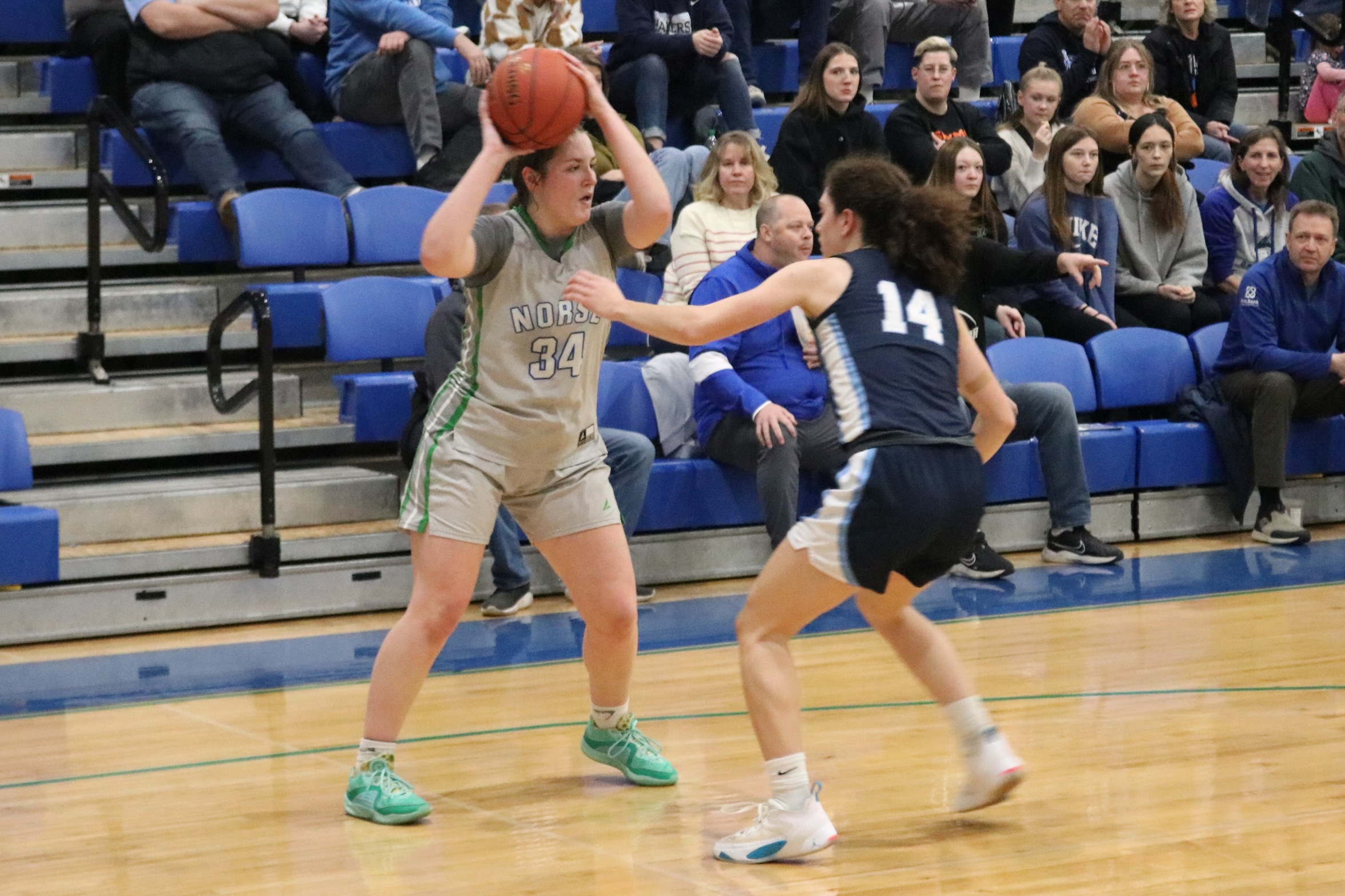 Jada Freudinger holds the ball while a defender waits for her next move