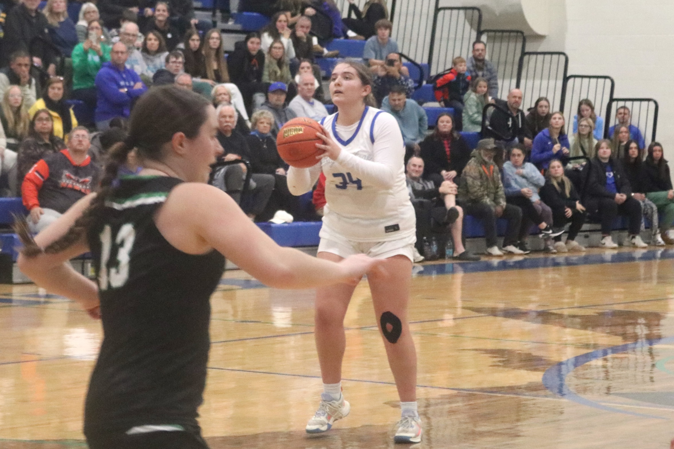 Addison Cullen finds herself open at the top of the key for a three-point attempt