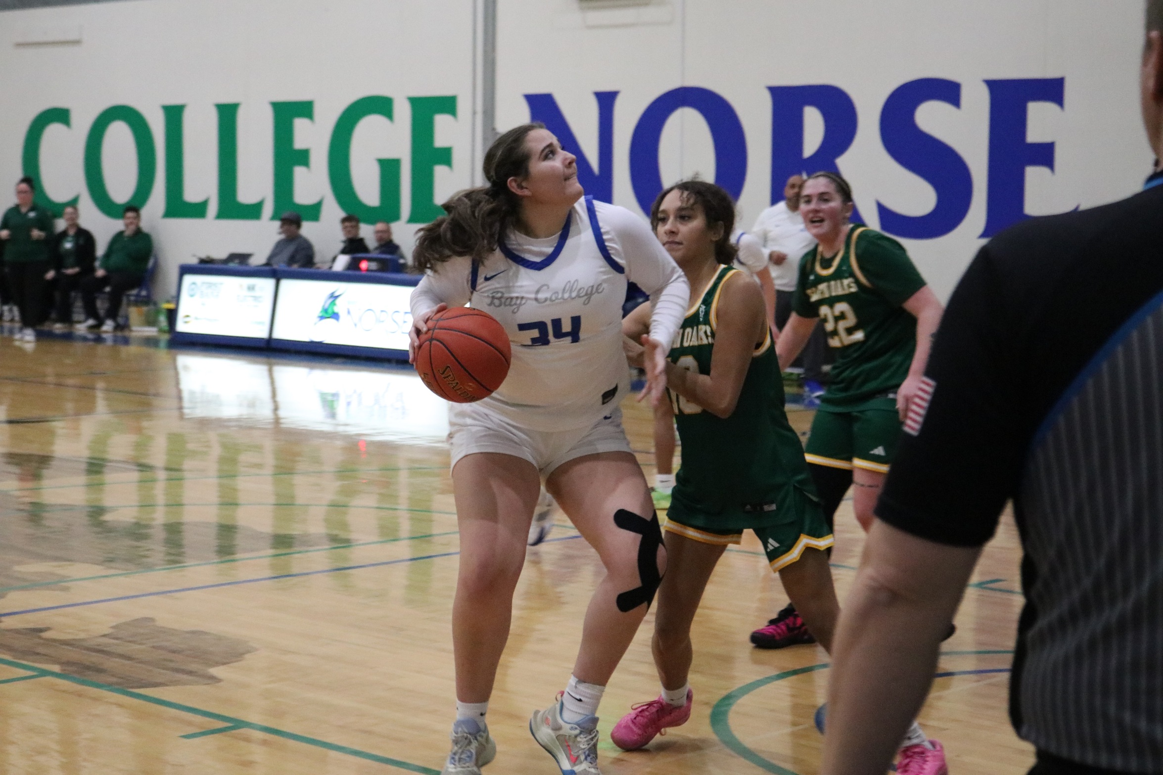 Addison Cullen dribbles in the lane as a defender tries to slow her
