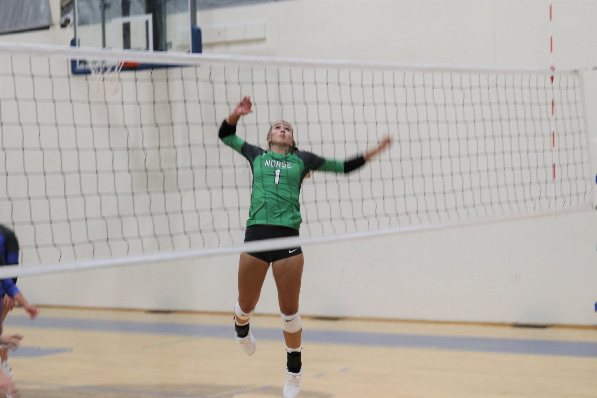 Leah Allan in the air, going for a kill