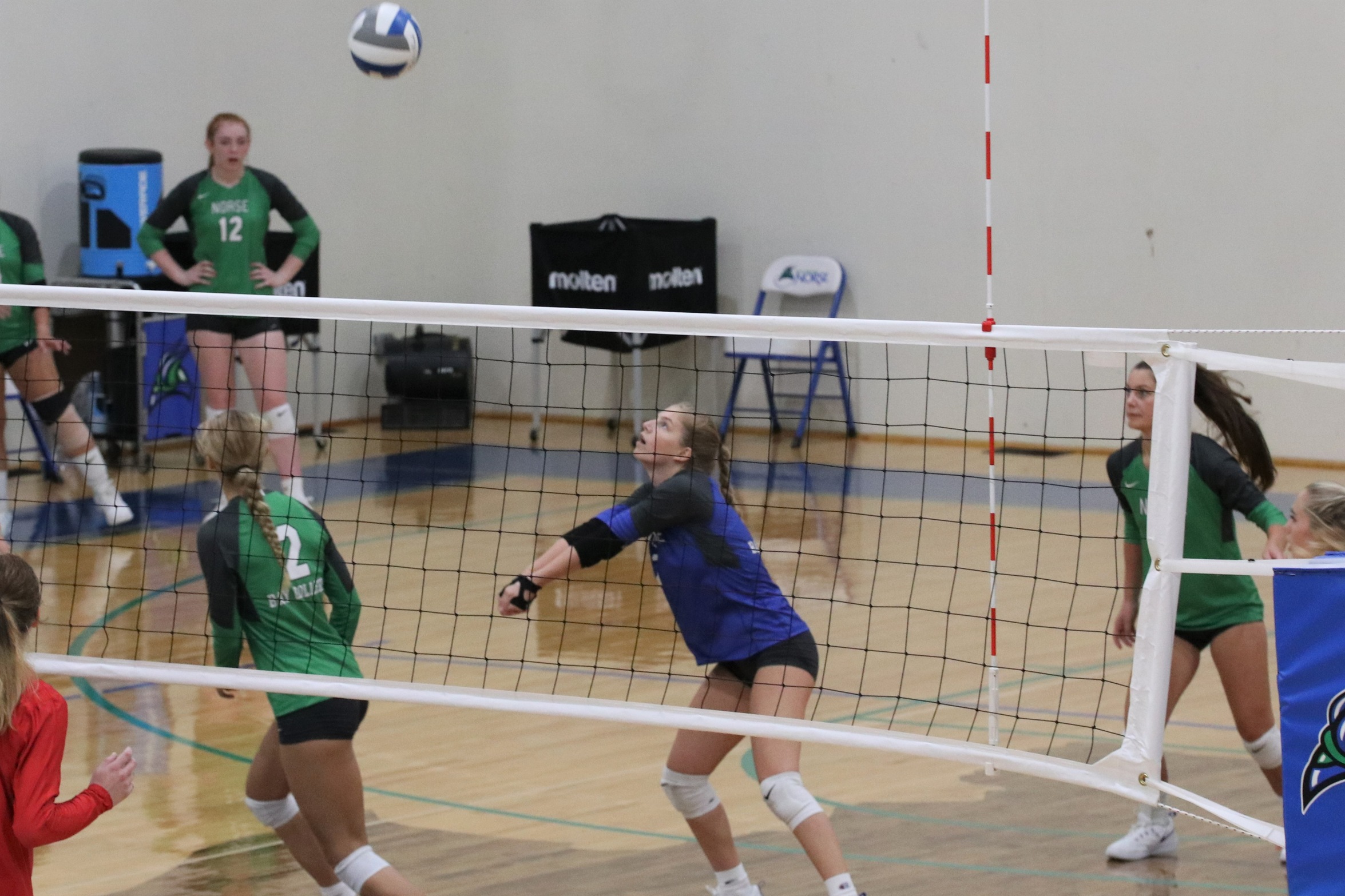 Tori Jandt receiving a dig 